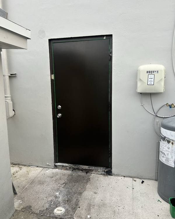 Worn exterior back door before painting