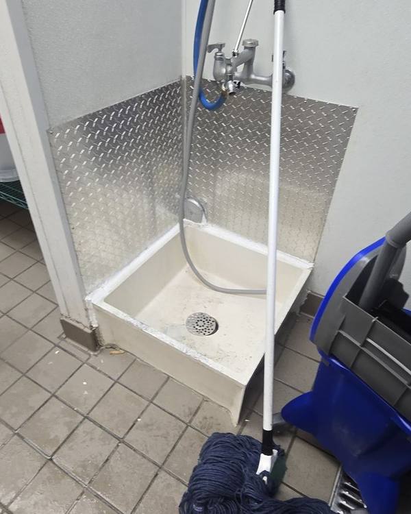Mop sink with a new diamond plate backsplash