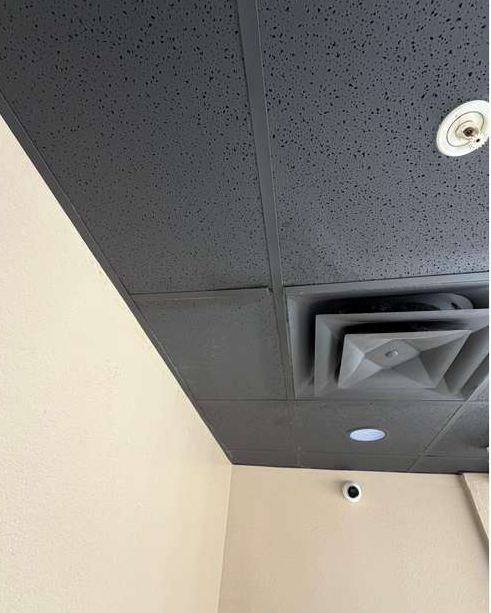 Clean replacement ceiling tile next to the air vent