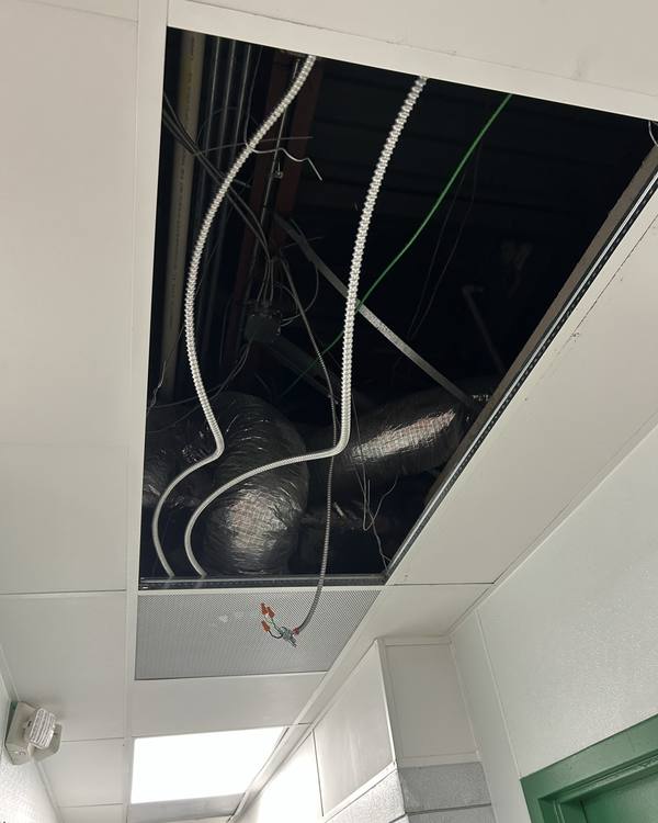 Ceiling opened to run new electrical wiring
