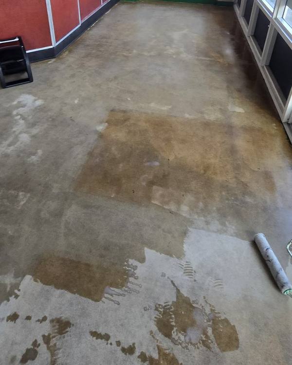 Dining area concrete floor partially restored, showing the difference