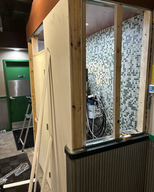 Wood framing for a new wall enclosure inside a restaurant
