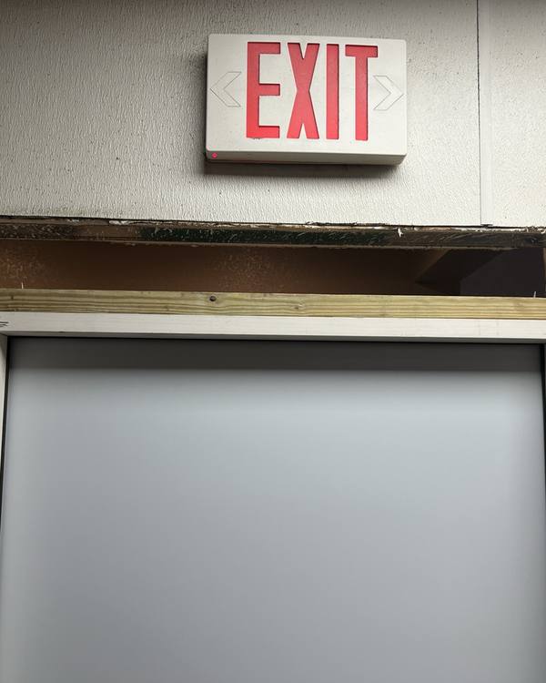 Old exit door frame opened for replacement