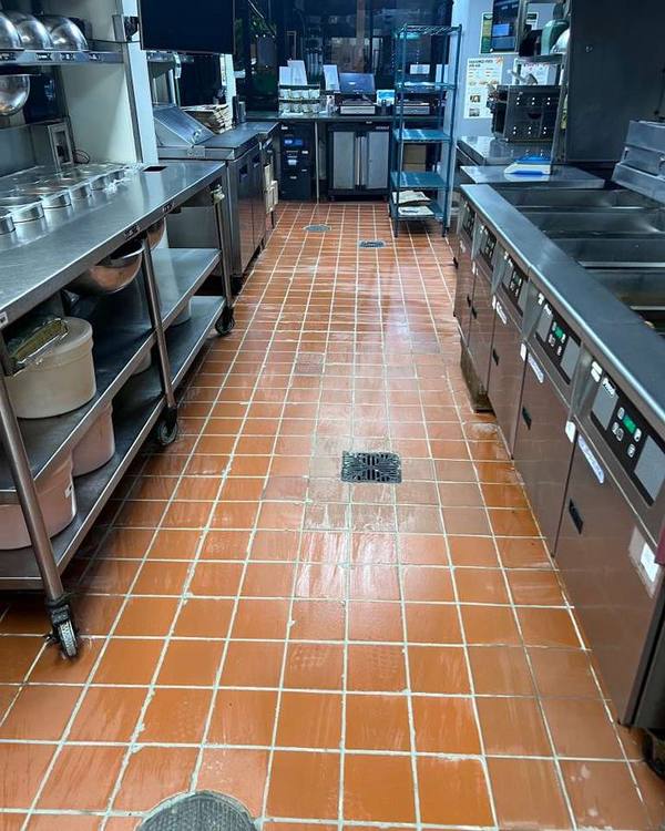 Clean quarry tile floor in a commercial kitchen