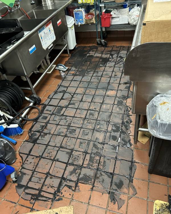 Old grout removed from a commercial kitchen floor