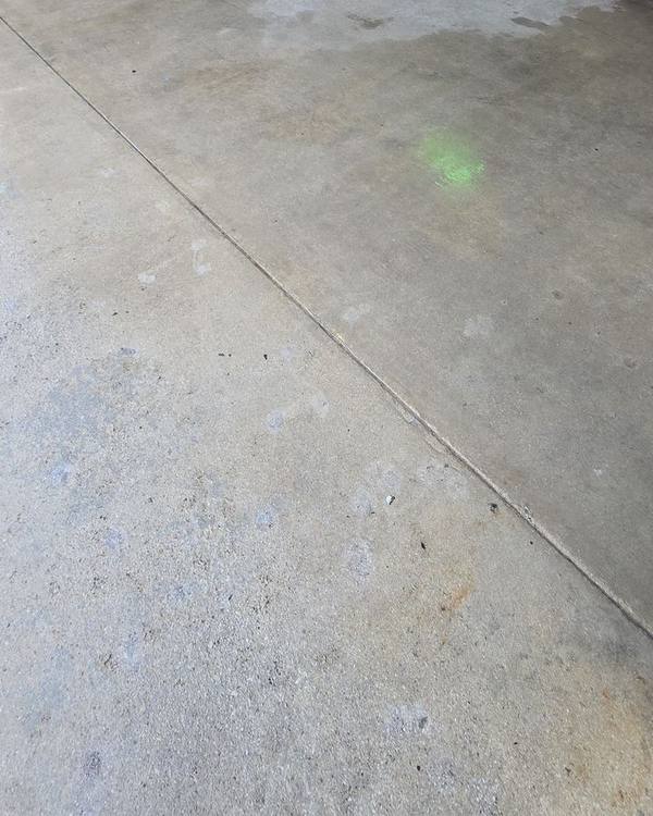 Clean storefront sidewalk after pressure washing
