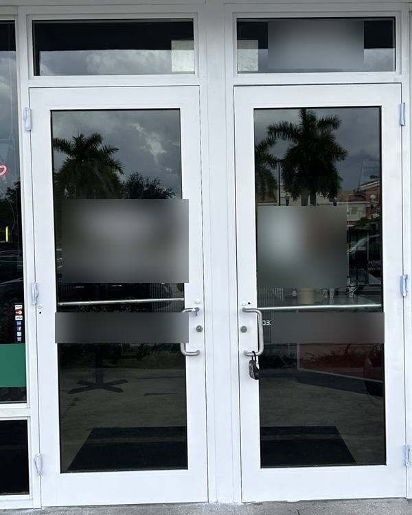 Storefront door frames freshly painted white