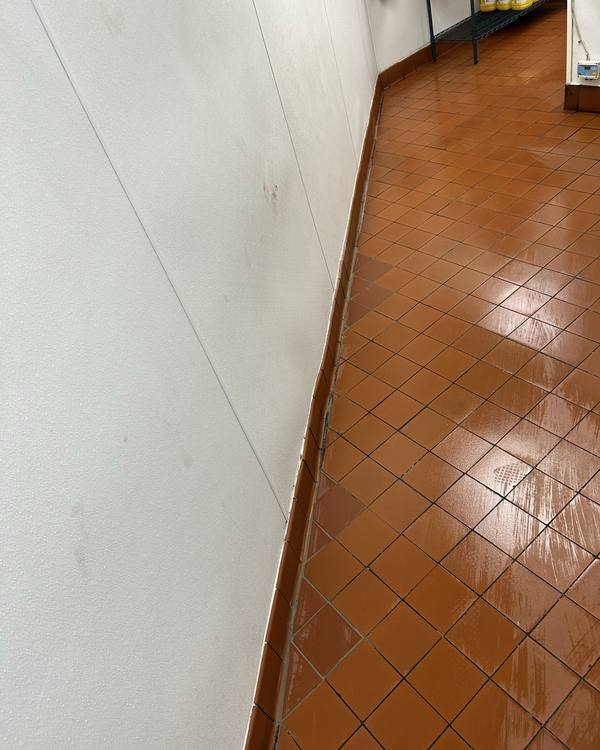 Floor tiles replaced along the kitchen wall